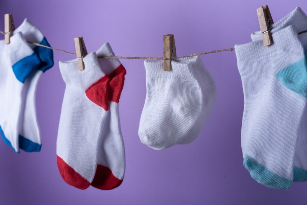 Premature baby day concept. Tiny socks